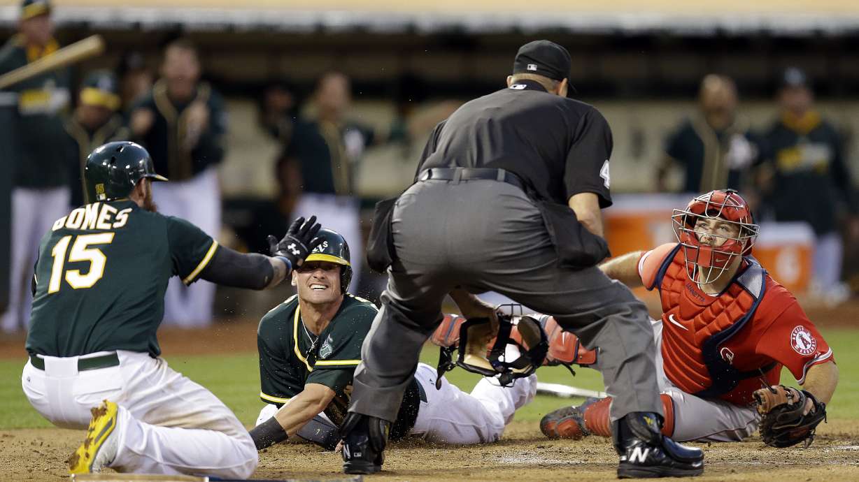 Crisp scores on wild pitch as A's beat Angels 2-1