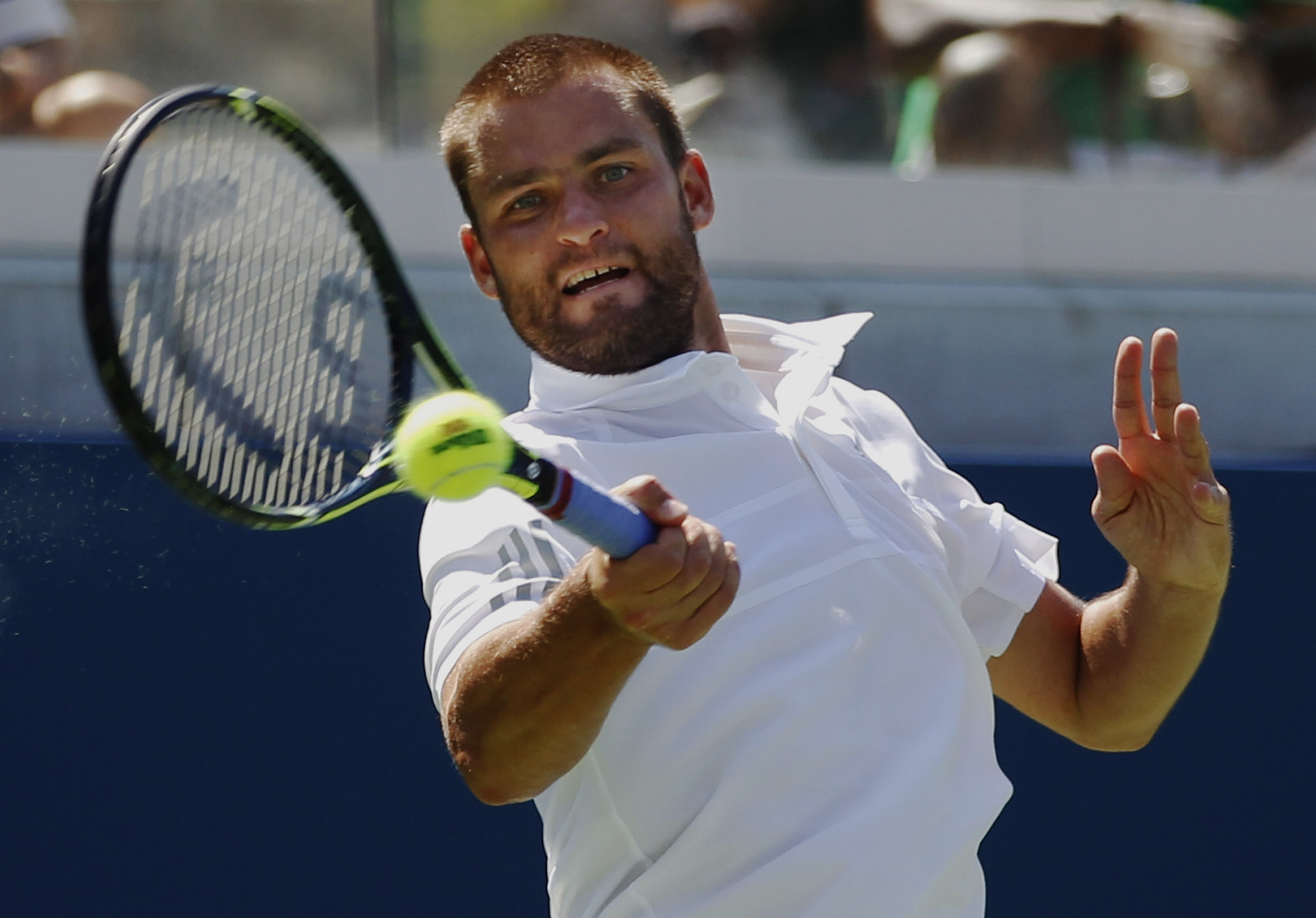 On edge of default, Kyrgios advances at US Open
