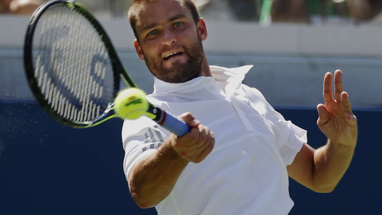 On edge of default, Kyrgios advances at US Open