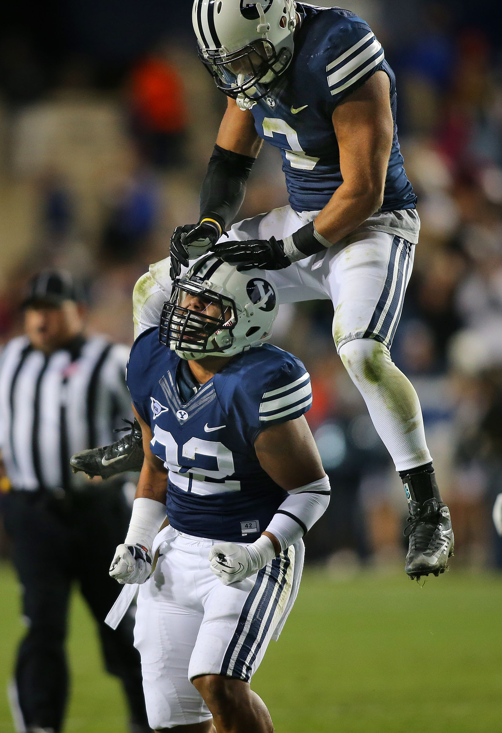 Brigham Young Cougars linebacker Manoa Pikula (22) celebrates with BYU linebacker Kyle Van Noy (3) after a sack as the Cougars play Middle Tennessee State Friday, Sept. 27, 2013, in Provo.