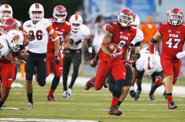 Utah Utes Kaelin Clay returns the ball for a touchdown on a kick off return during PAC 12 action in Salt Lake City Thursday, Aug. 28, 2014. Utah won 56-14.