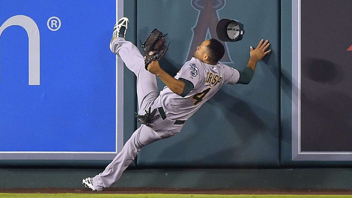 Angels beat A's 4-0 behind Weaver, up AL West edge