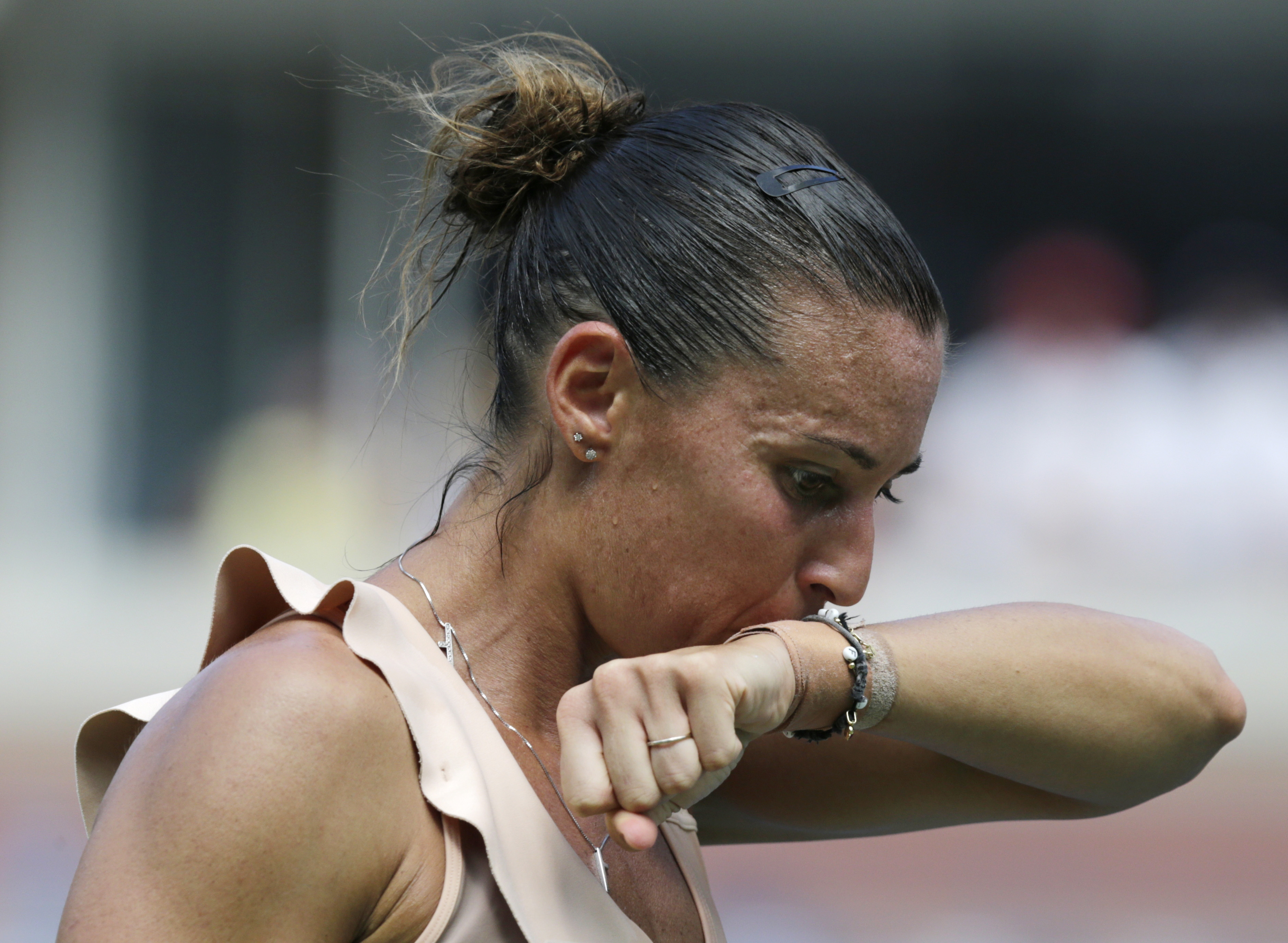 Dizzy in heat, Bouchard out of upset-heavy US Open