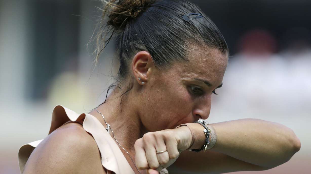 Dizzy in heat, Bouchard out of upset-heavy US Open