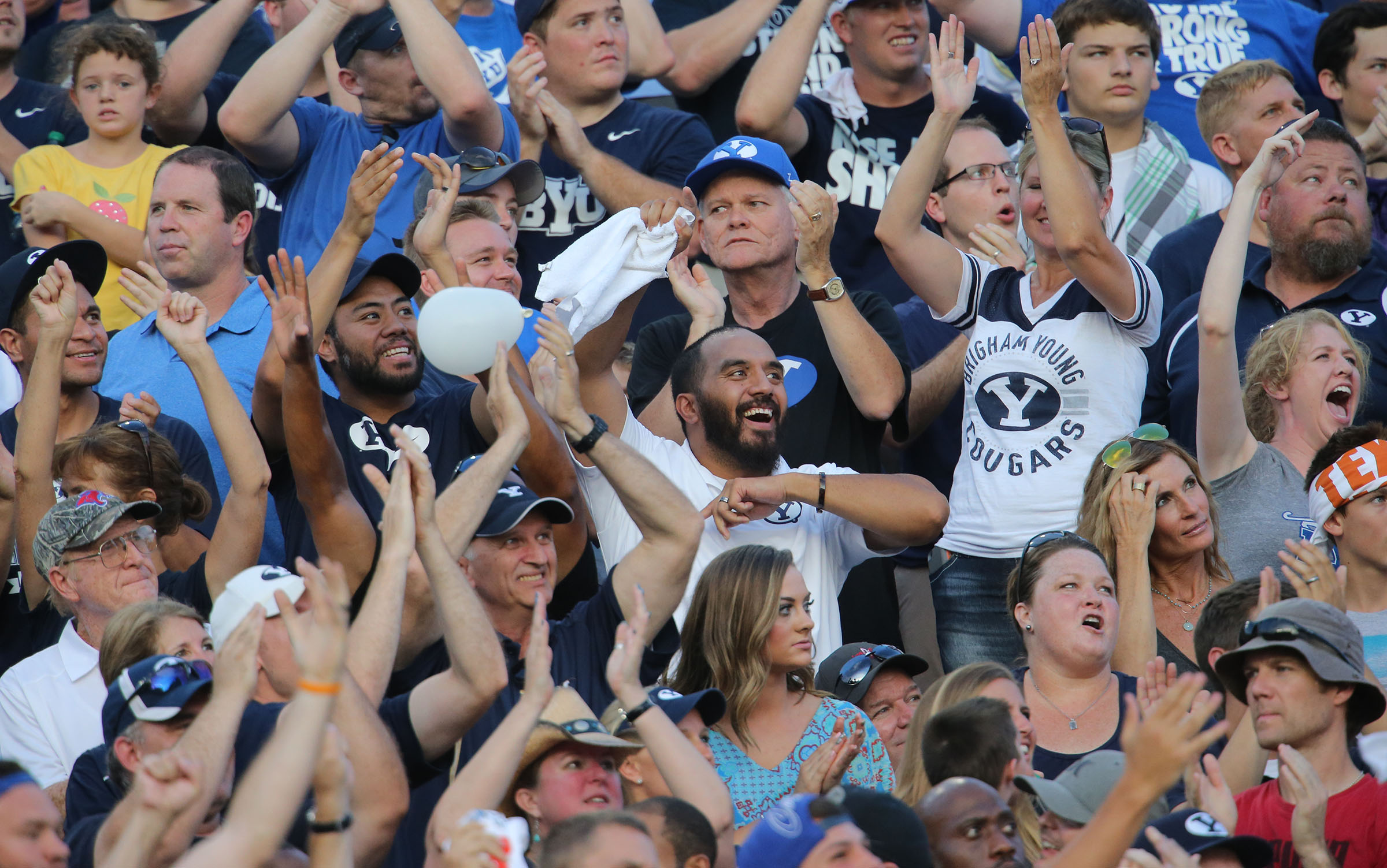 BYU fans cheer as BYU and Texas play Saturday, Sept. 6, 2014, in Austin Texas.