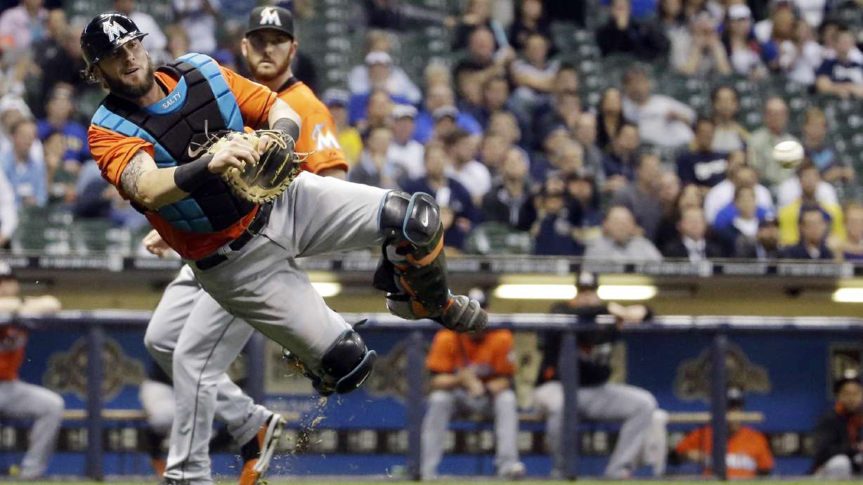 Clark, Peralta lift Brewers past Marlins, 4-1