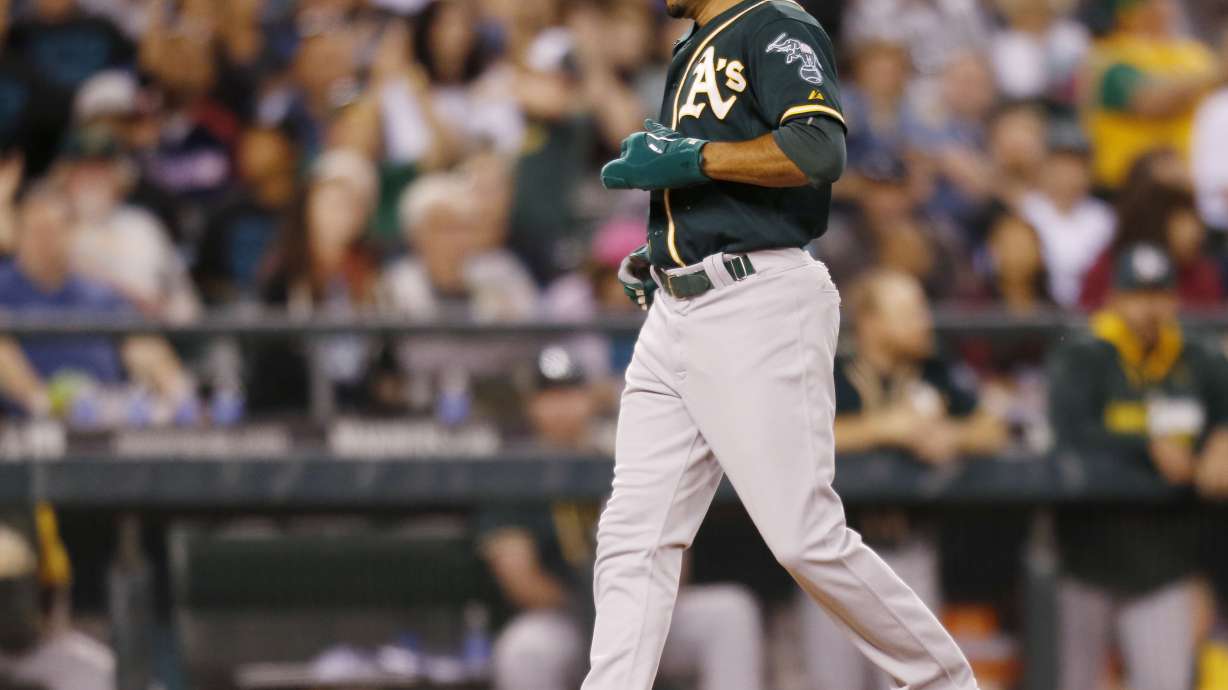Lowrie draws bases-loaded walk in 10th to lift A's