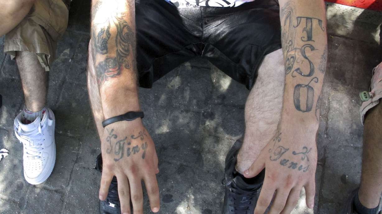 Street gangs tone down use of colors, tattoos