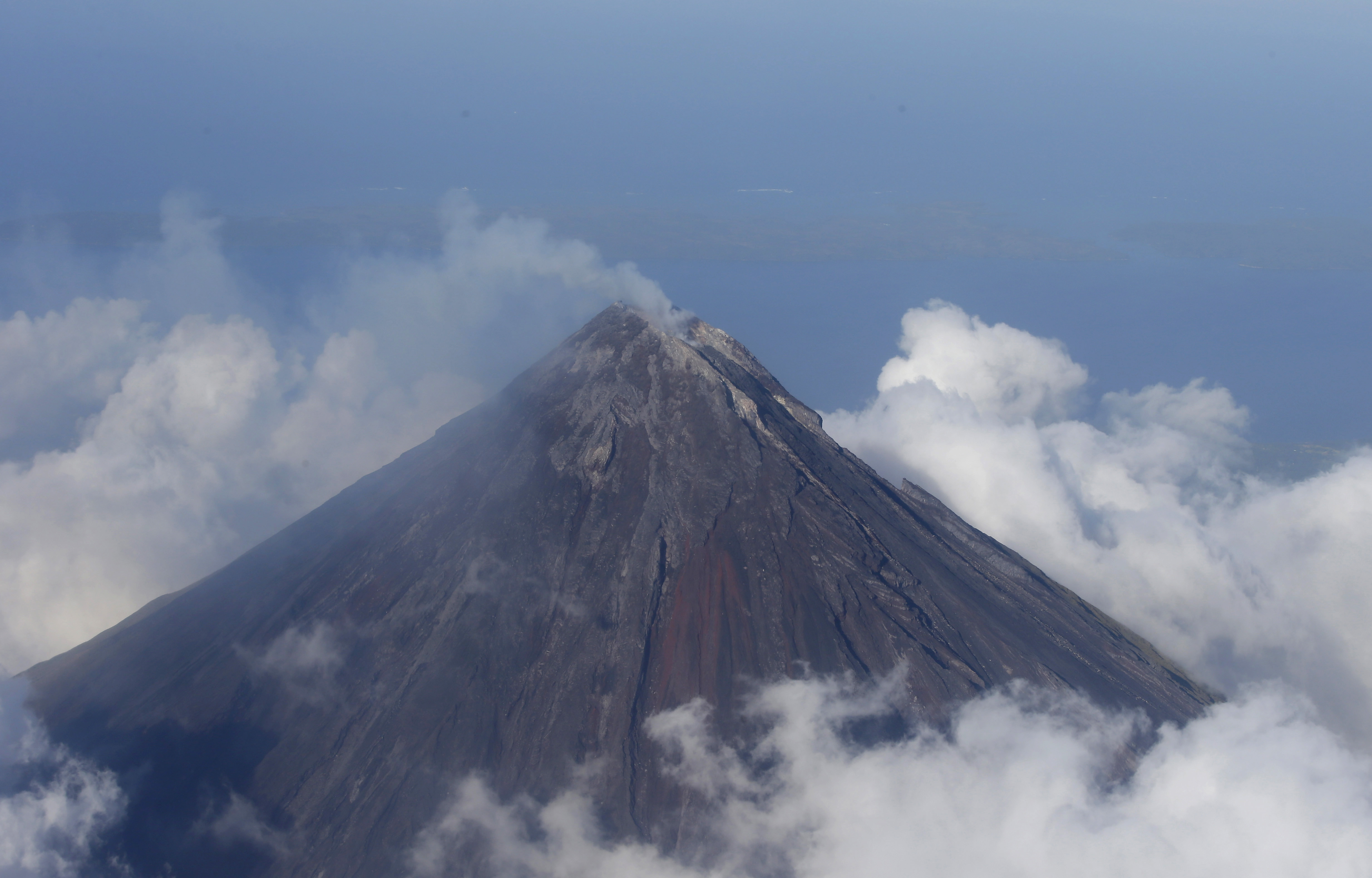 Lava flows from Philippine volcano; thousands flee