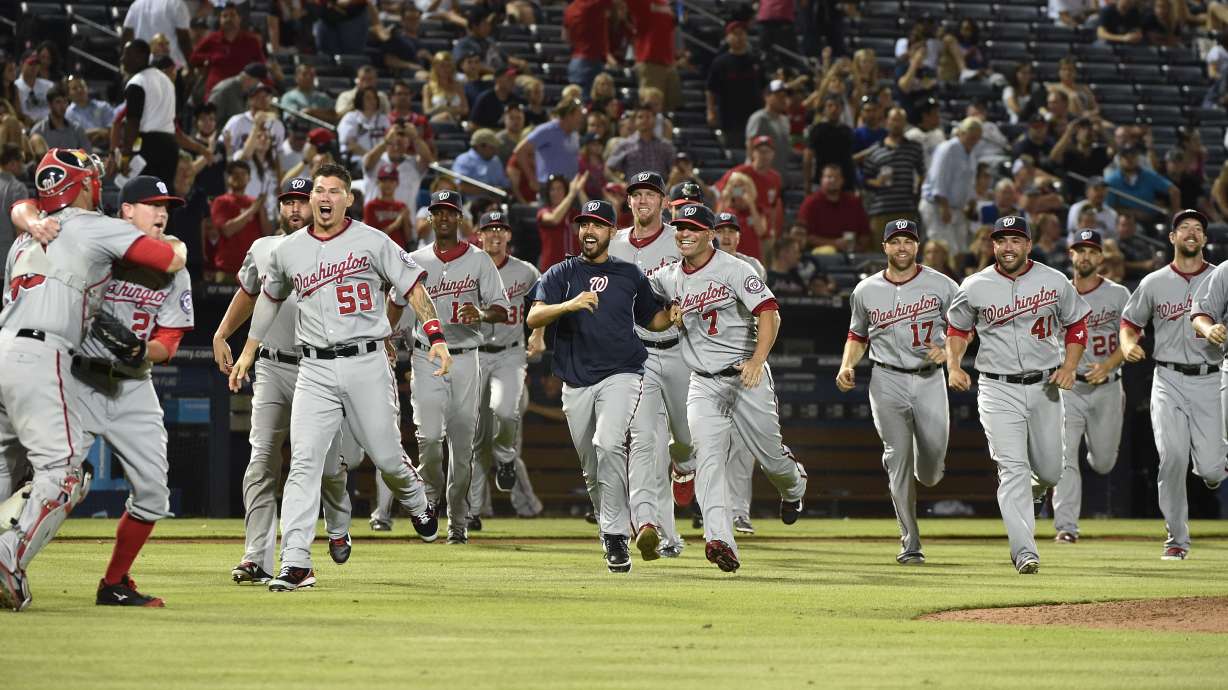 Fading Braves watch Nats celebrate NL East title