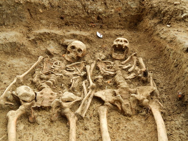 Skeletons found 'holding hands' after 700 years