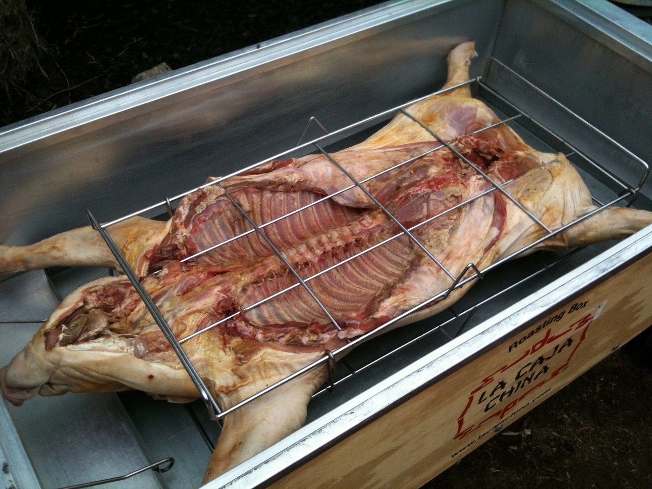 For a stellar tailgate, consider cooking a whole pig