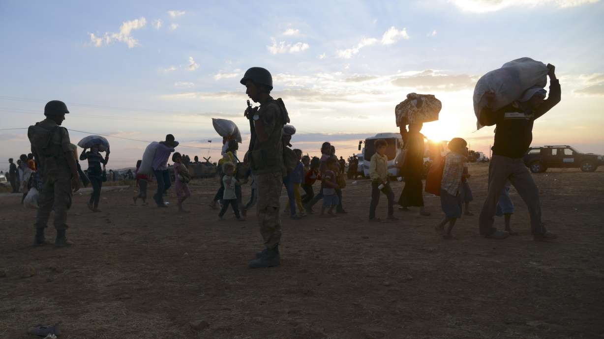 Syria refugee flood to Turkey hits 100,000