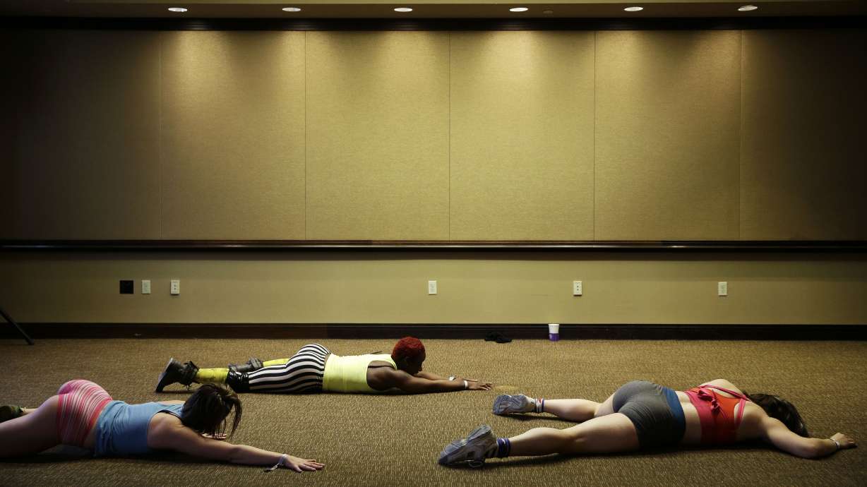 AP PHOTOS: Pole dancing being used for fitness