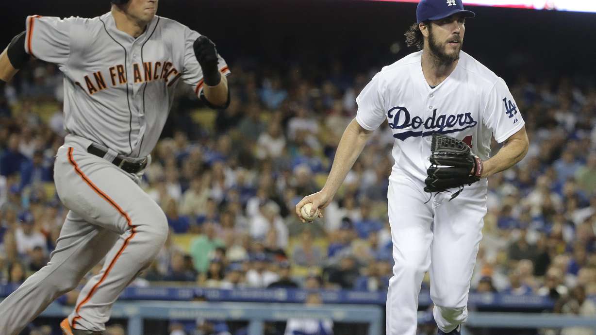 Dodgers lose to Giants in 13, lead cut to 3 1/2