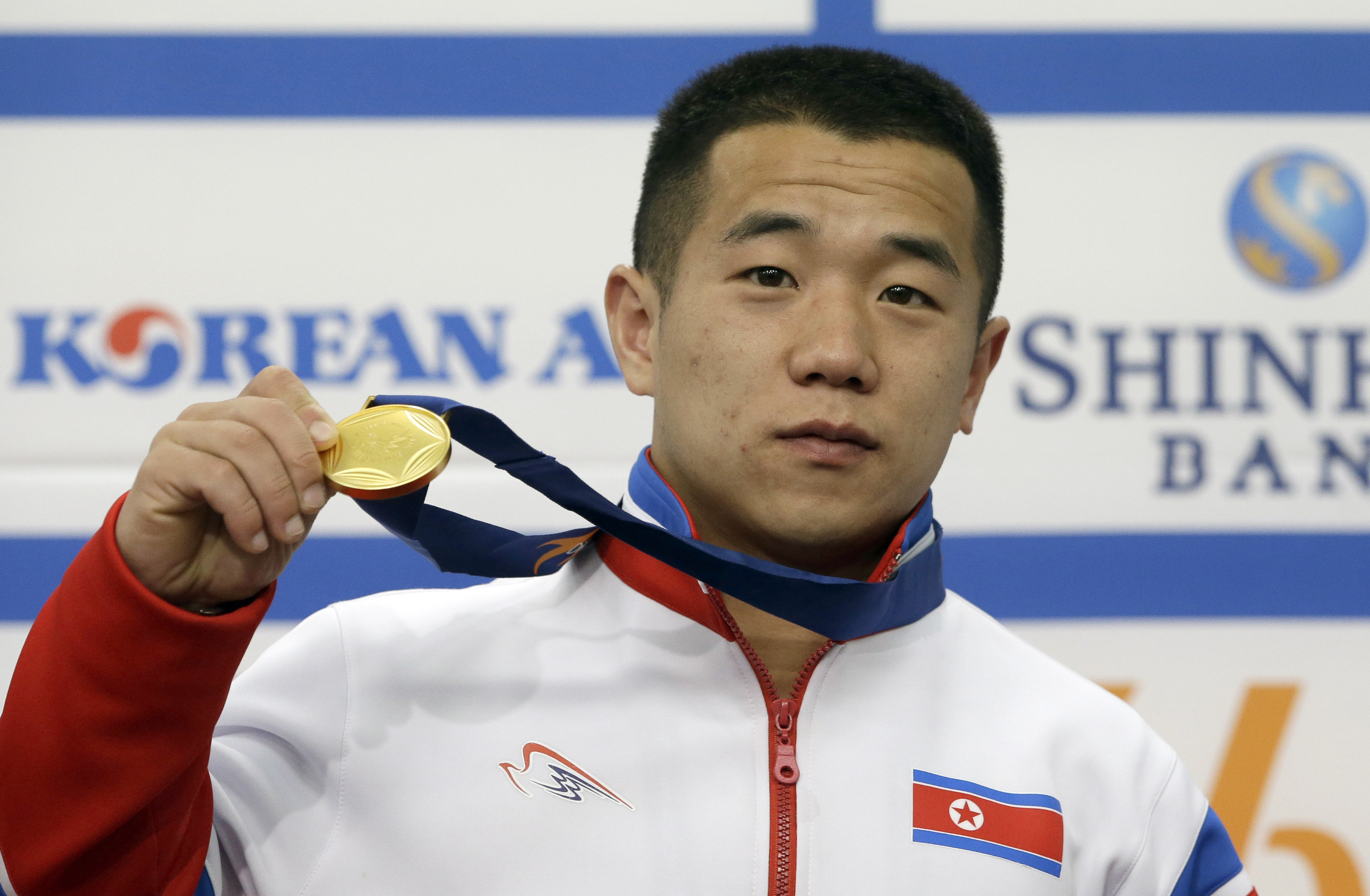 Together at Asian Games, Koreas still far apart
