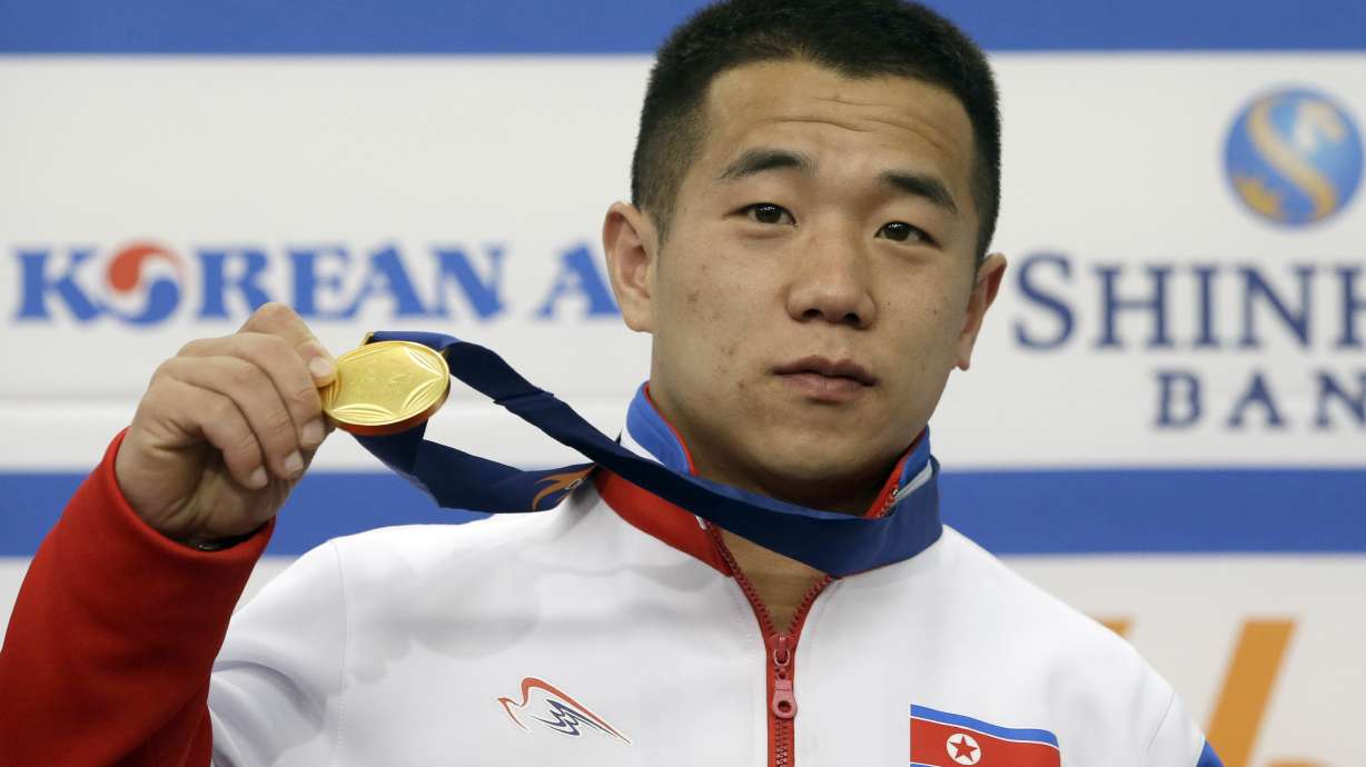 Together at Asian Games, Koreas still far apart