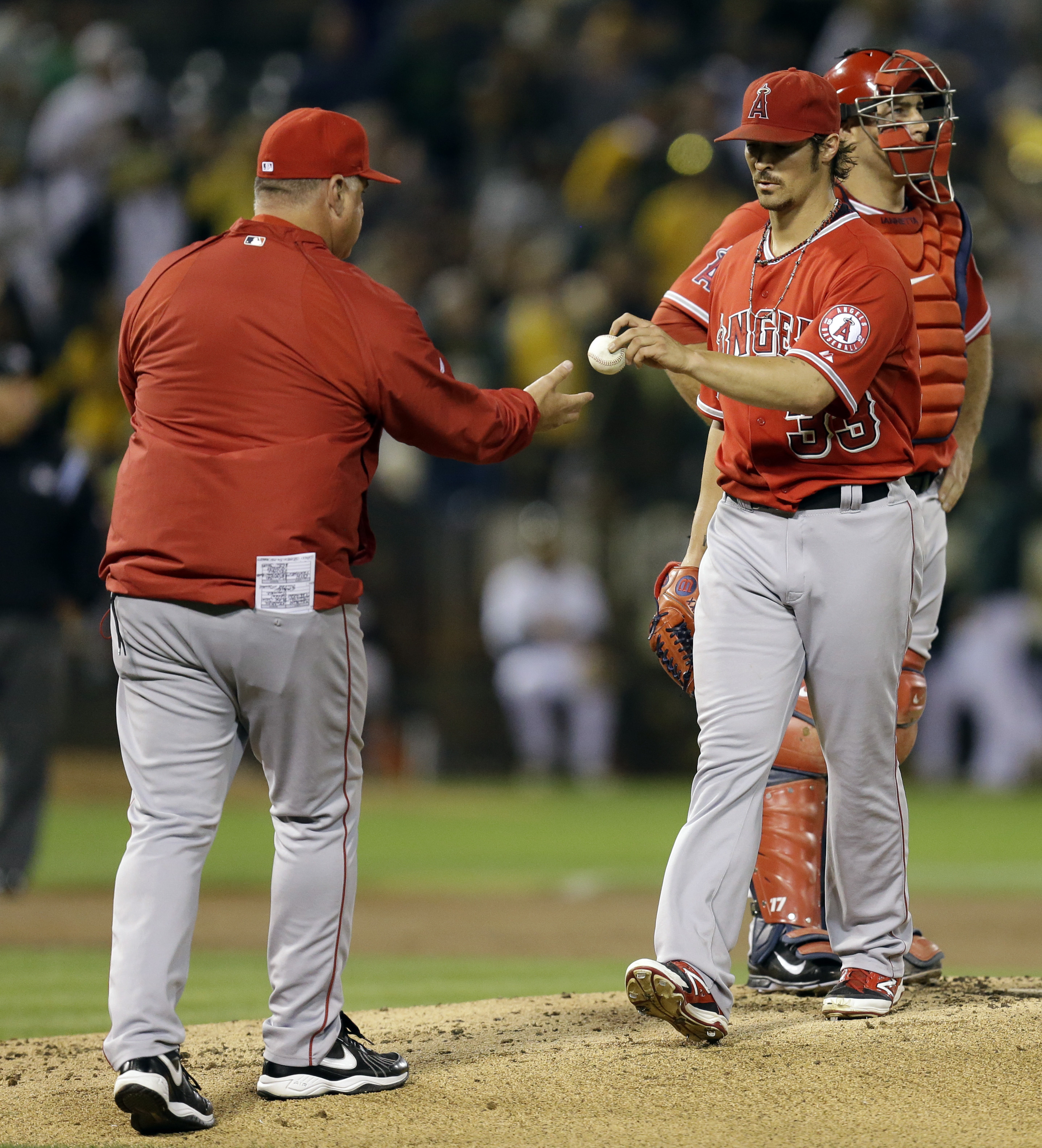 Wilson knocked out early, Angels lose 8-4 to A's