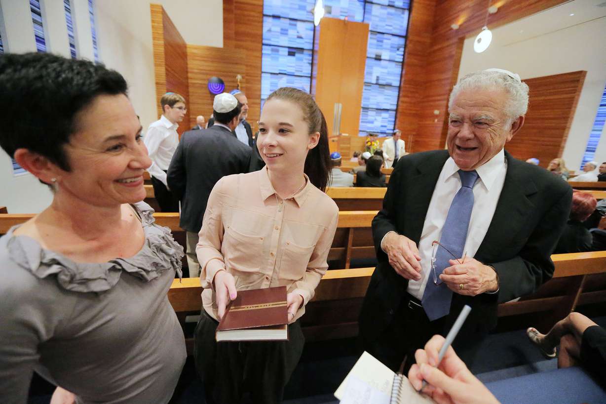 Jerome Epstein, his daughter Miriam Footer and granddaughter Emily Epstein talk prior to the meeting as members of the Jewish community in Park City gather Wednesday, Sept. 24, 2014, in Temple Har Shalom, to celebrate the new year.