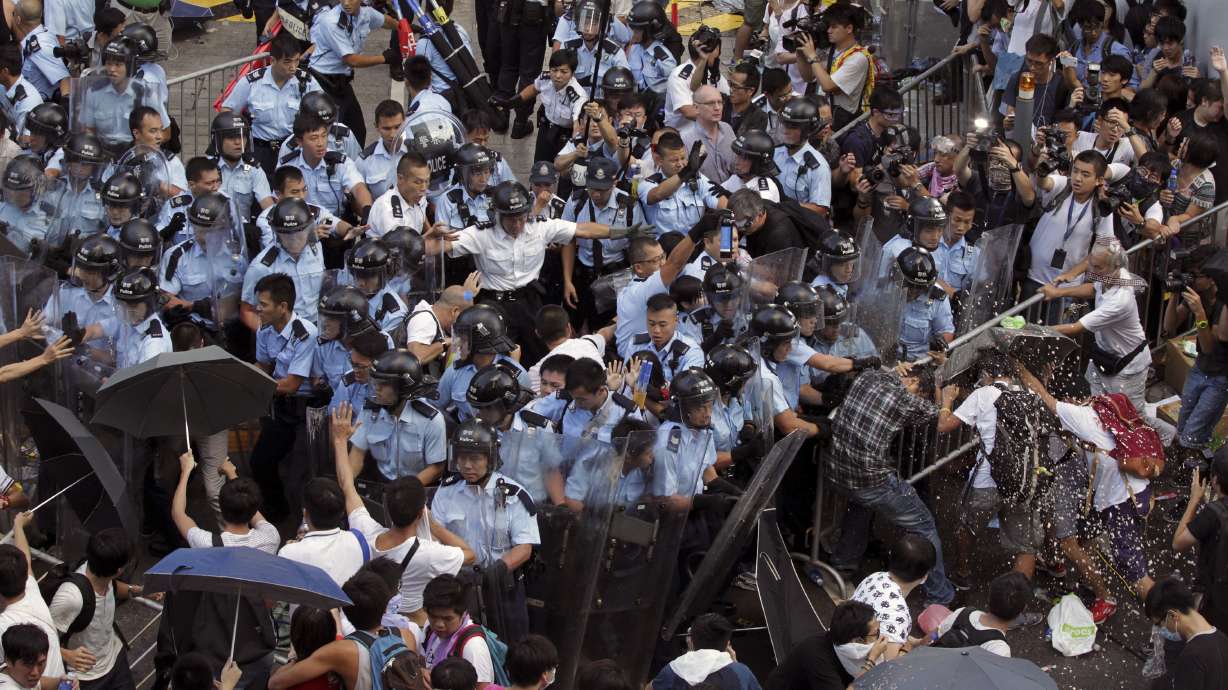 HK students scuffle with police in chaotic protest