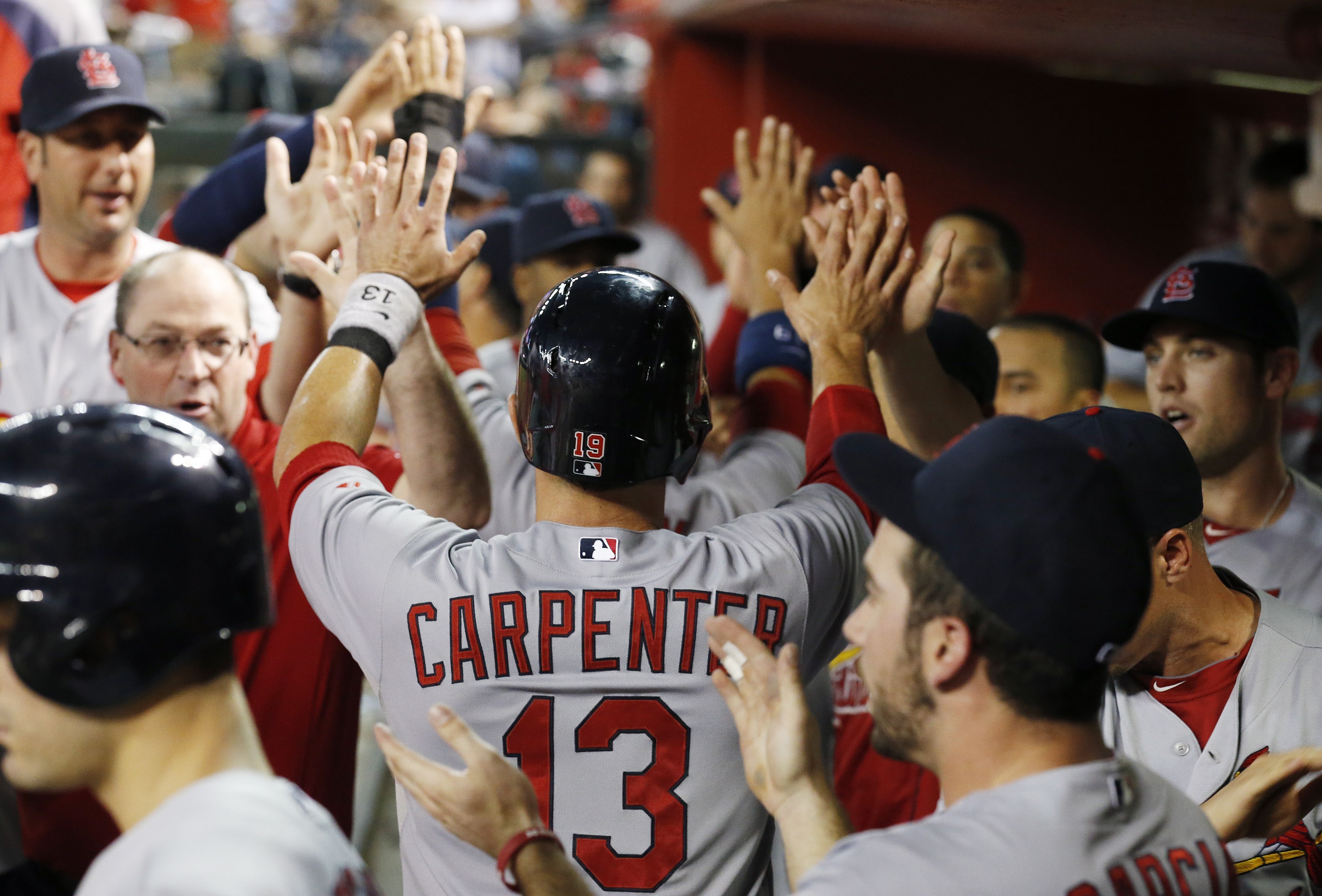 Cardinals beat Arizona in 10, stay alone in 1st