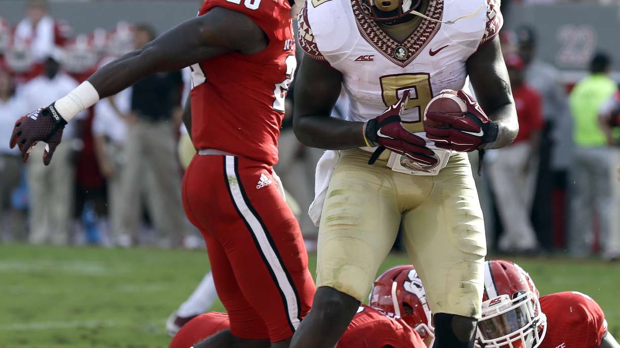No. 1 Seminoles rally past Wolfpack 56-41