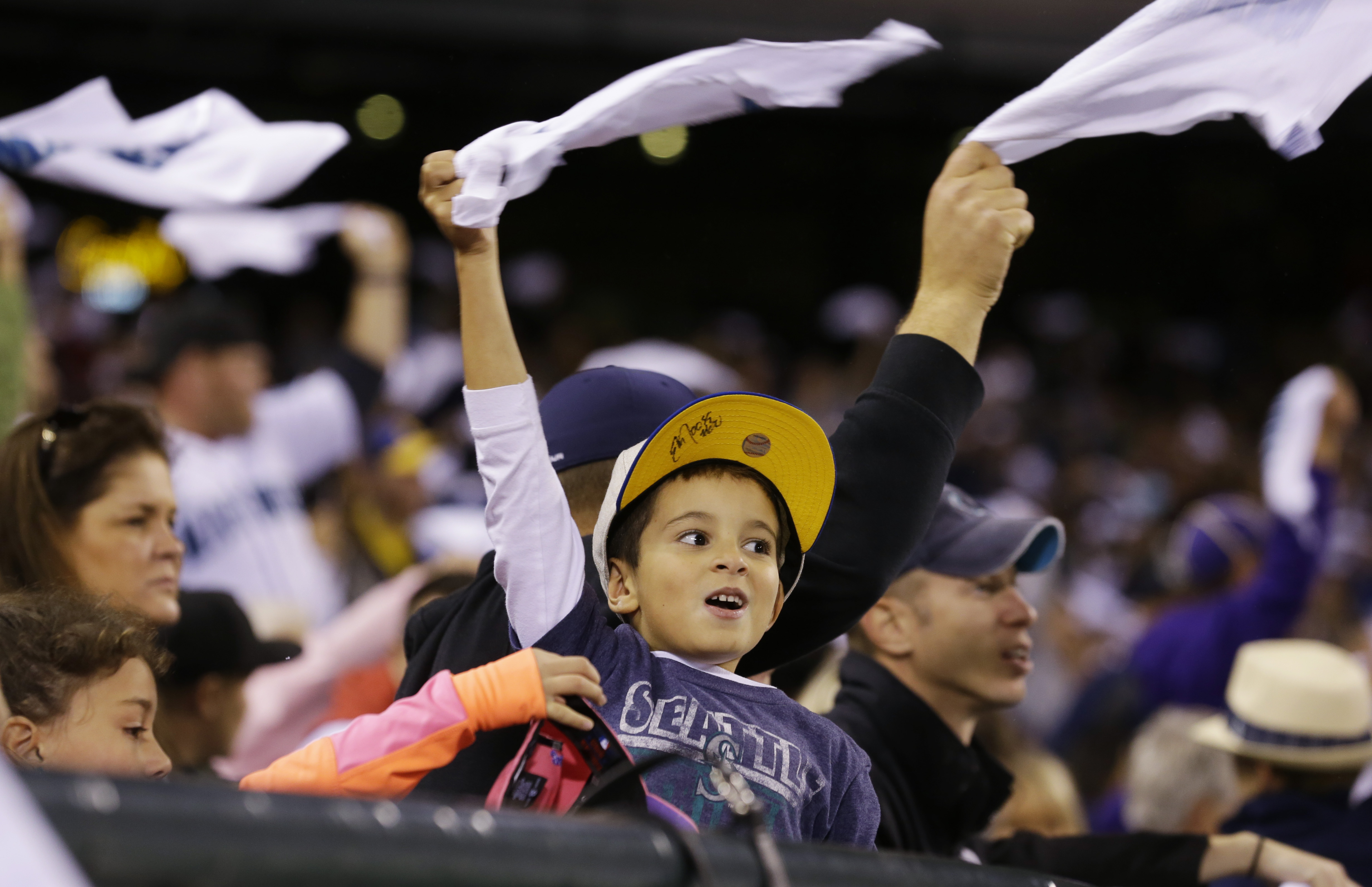 Mariners still in playoff race, beat Angels in 11