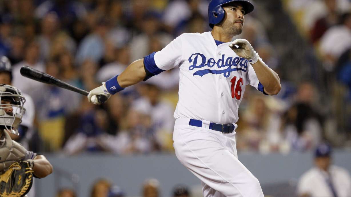 Dodgers top Rockies 6-5 in 12th on wild pitch
