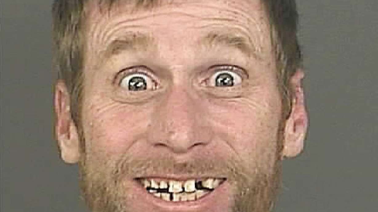 Big smile in Denver bank robbery suspect mug shot