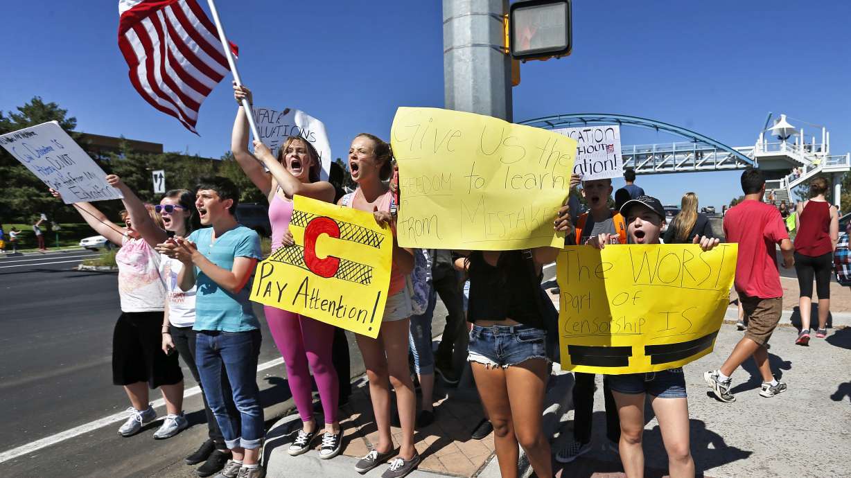 Teachers shut down 2 suburban Denver high schools