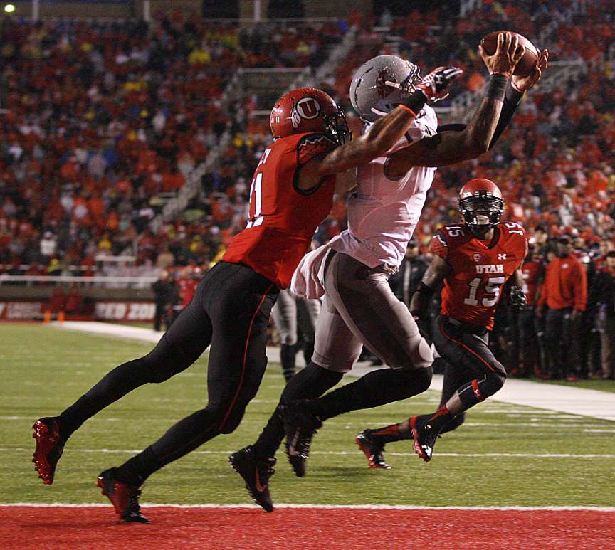 Washington's 1 Vince Mayle catches a pass in the end zone before Utah's Davion Orphey in the Utah vs. Washington State at Rice-Eccles Stadium in Salt Lake City on Saturday, Sept. 27, 2014.