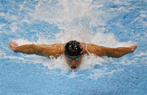 United States' Michael Phelps swims in the men's 100-meter butterfly swimming final at the Aquatics Centre in the Olympic Park during the 2012 Summer Olympics in London, Friday, Aug. 3, 2012.