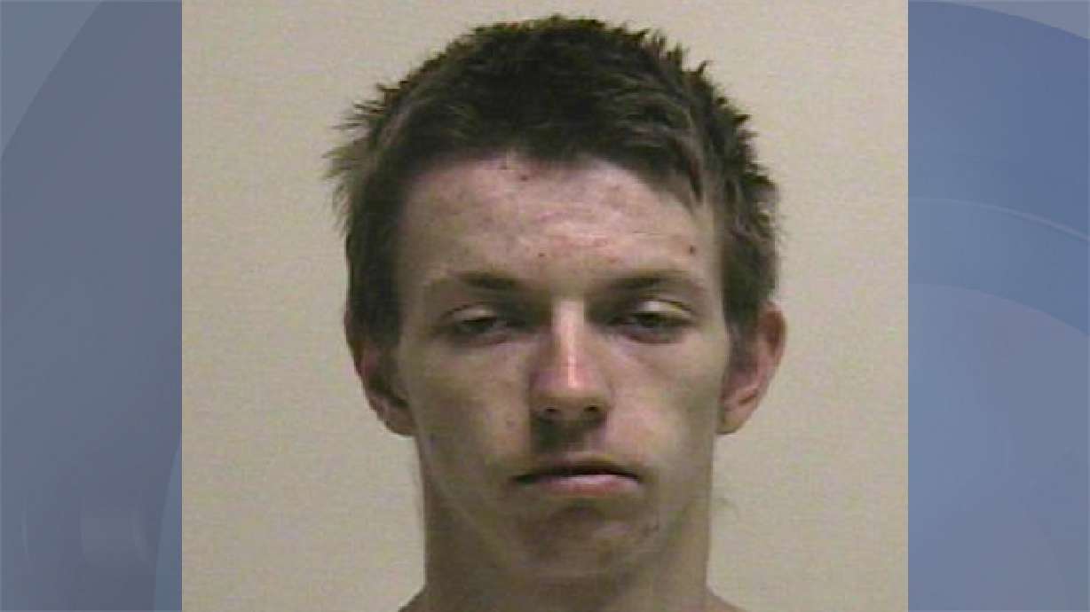 Armed robber found hiding in neighbor's backyard, police say