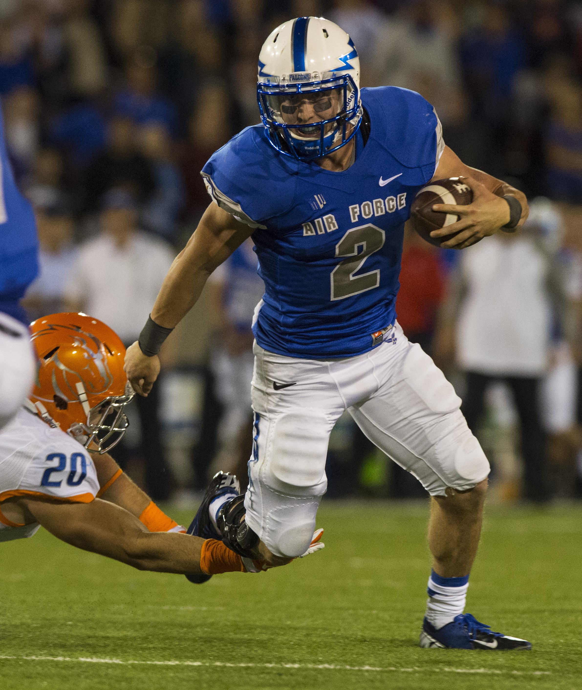 Air Force quarterback Kale Pearson runs past Boise State linebacker Tanner Vallejo to the Boise State 5-yard line on a third-and-goal during the third quarter of an NCAA college football game Saturday, Sept. 27, 2014. (AP Photo)
