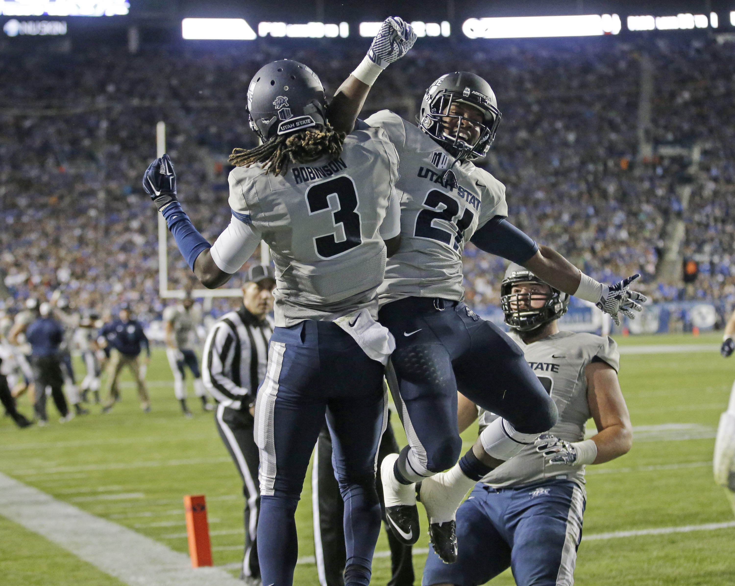 Hill breaks leg, No. 18 BYU loses 35-20 to Utah St