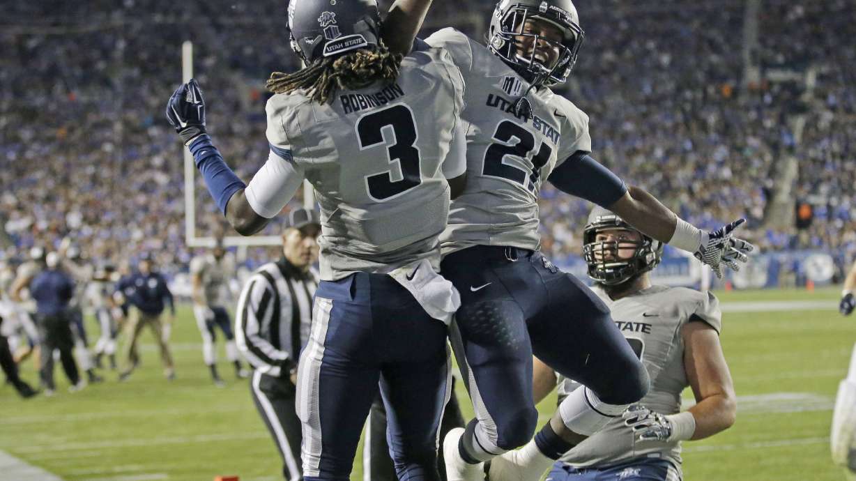 Hill breaks leg, No. 18 BYU loses 35-20 to Utah St