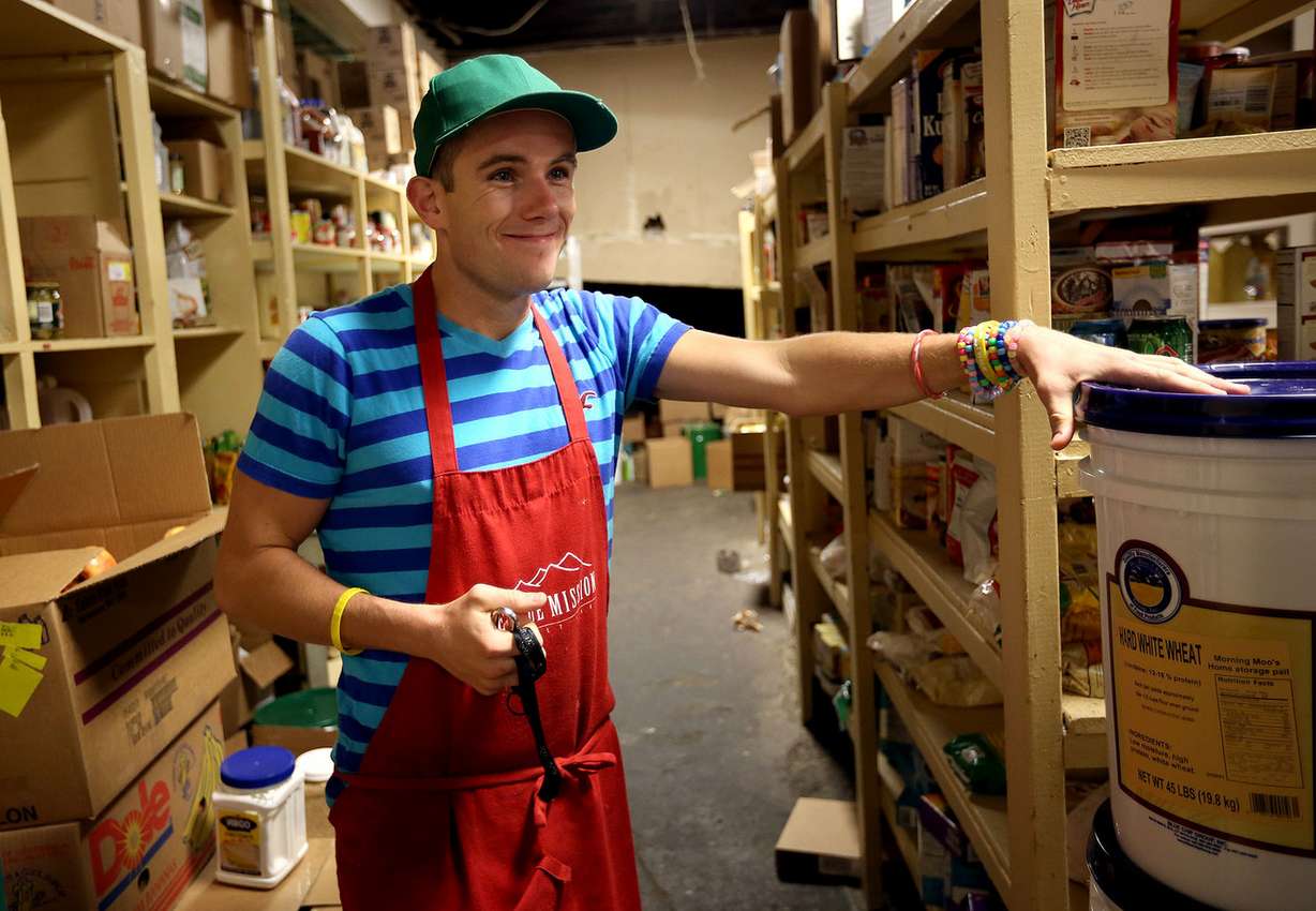 Nate Ely talks about the different places that donate to the food pantry at the Salt Lake Rescue Mission in Salt Lake City on Friday, Oct. 3, 2014.