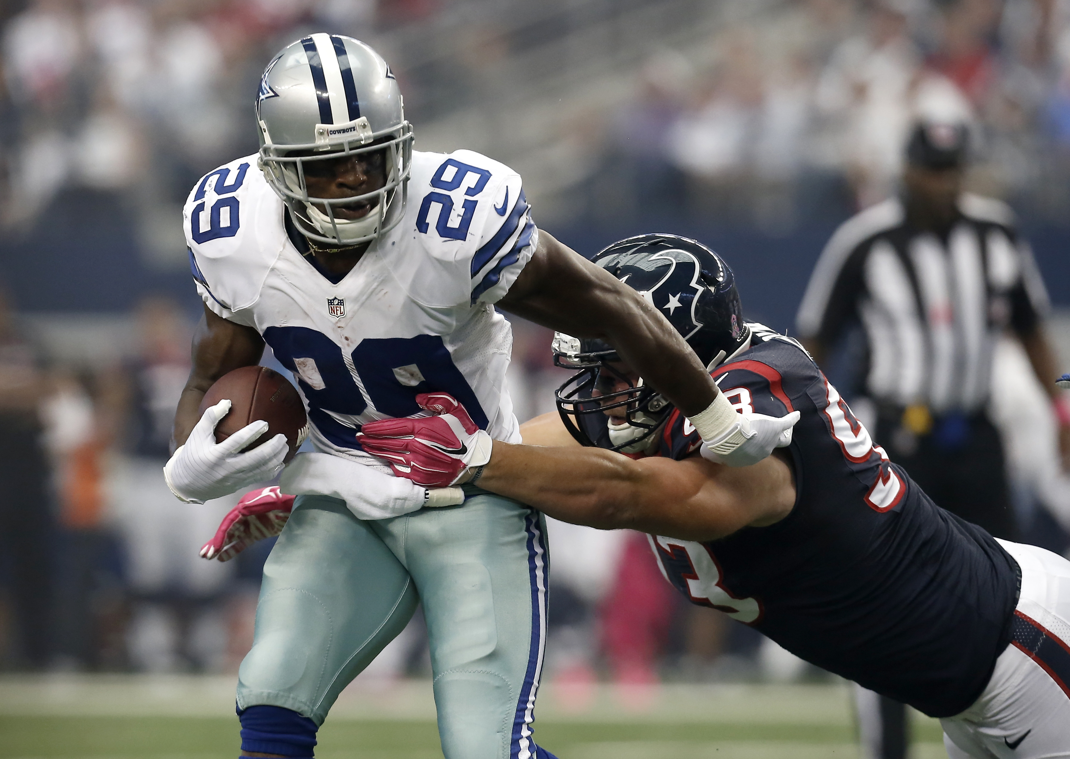 Romo, Bryant carry Cowboys past Texans 20-17 in OT