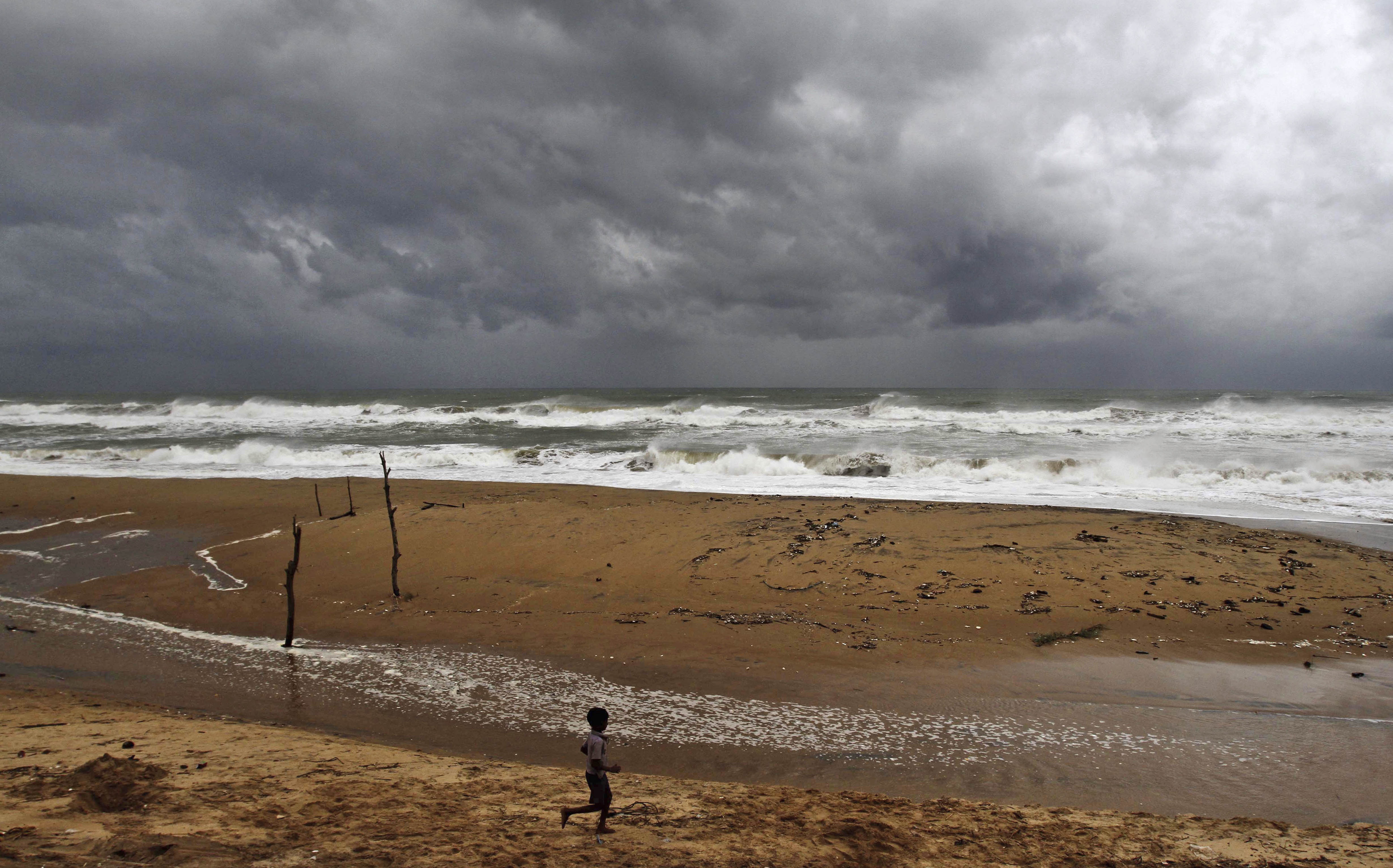 Cyclone in India kills 8 as typhoon hits Japan