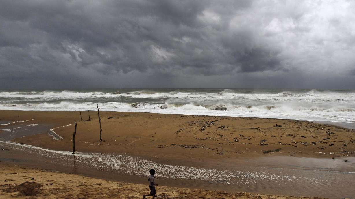 Cyclone in India kills 8 as typhoon hits Japan