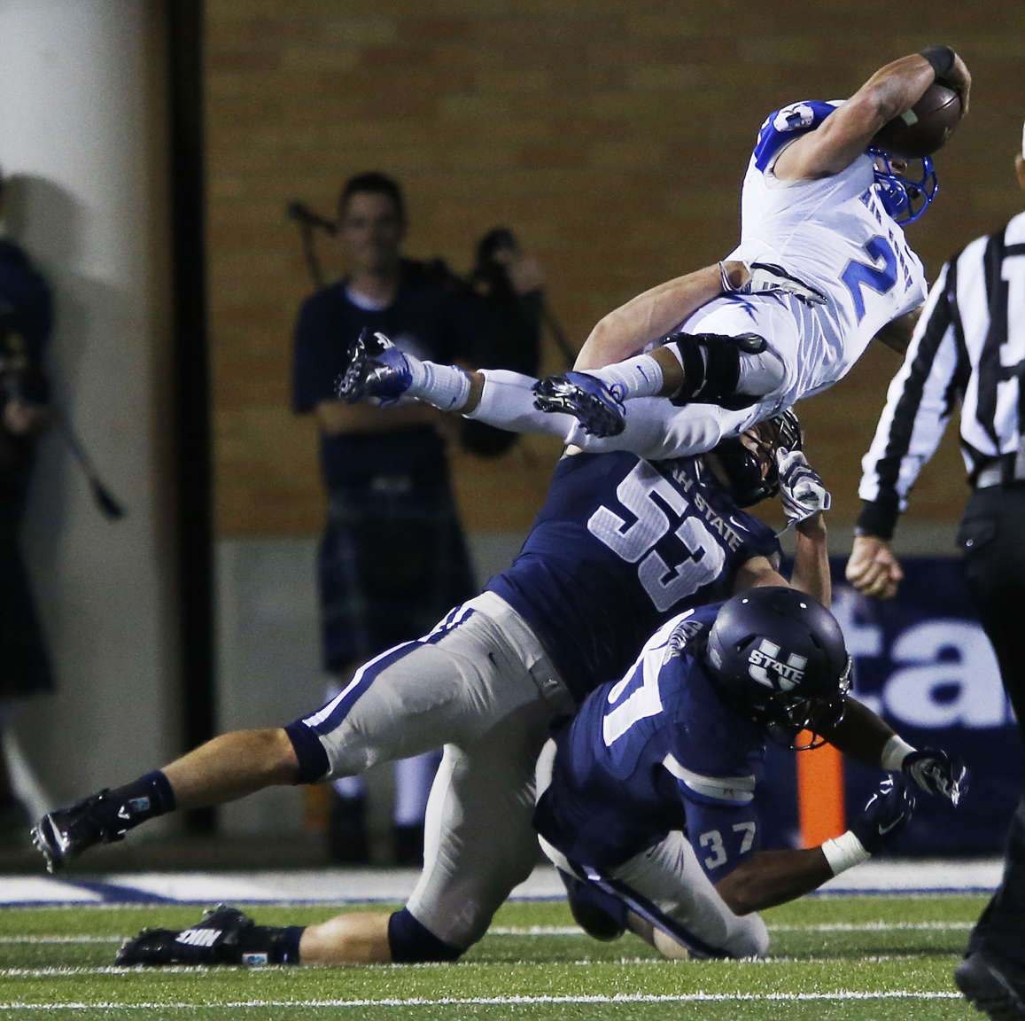 Utah State linebacker Zach Vigil tackles Air Force quarterback Kale Pearson during a game at Romney Stadium in Logan. Vigil and the other Aggie seniors will play their final home game Friday against San Jose State. (AP file photo)