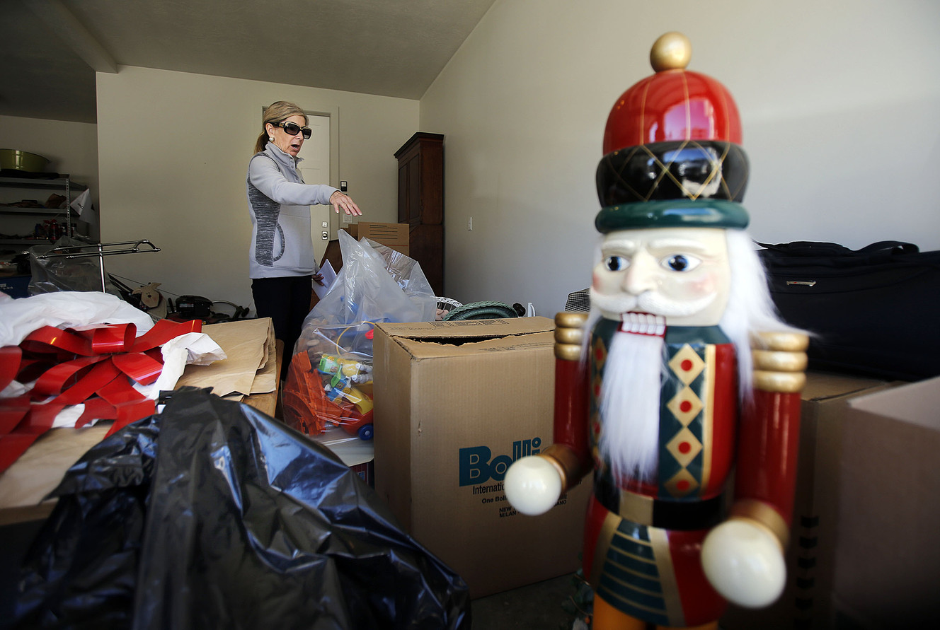 Leslie Leoncini talks about flood-damaged items at her home in Salt Lake City, Monday, Oct. 13, 2014. (Photo: Ravell Call, Deseret News)