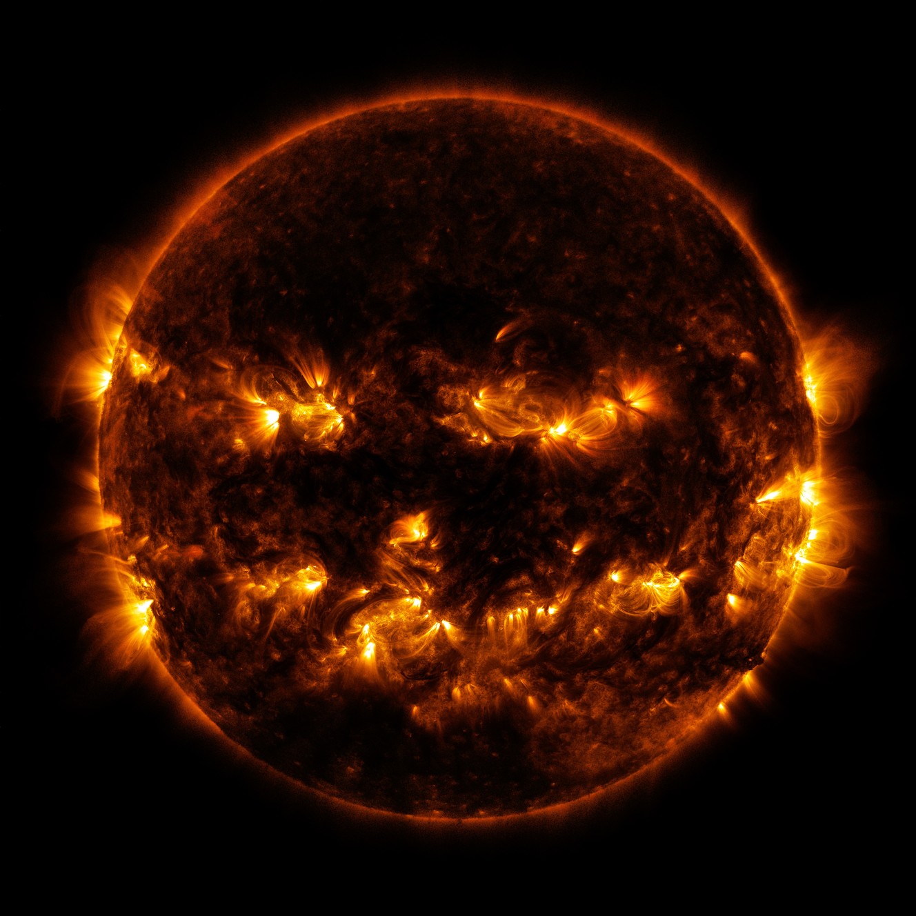 Photos: Sun emits jack-o’-lantern face