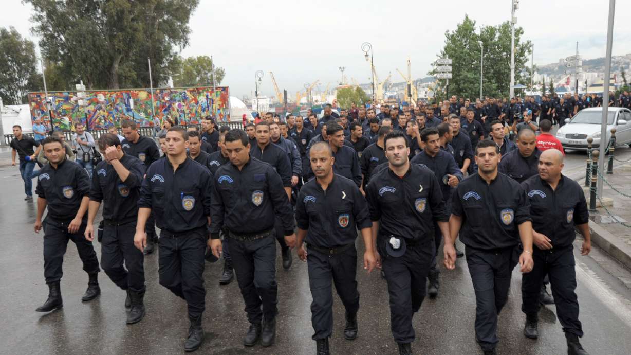 Algerian police march on president's office