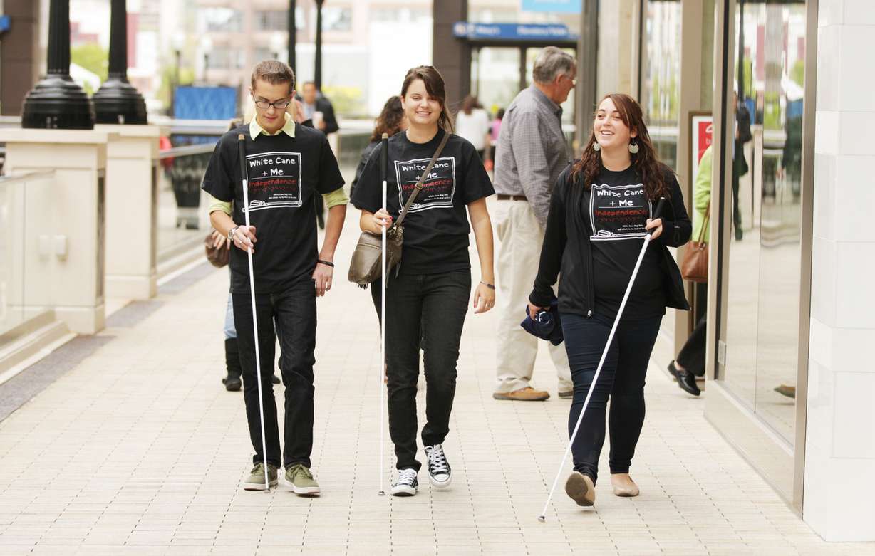 Peyton Barber, Kendyl Floyd and Maddy Stafford walk through City Creek Center during White Cane Safety Day in Salt Lake City Wednesday, Oct. 15, 2014. The day celebrates achievements of people with vision impairment in the United States. (Photo: Jeffrey D. Allred, Deseret News)