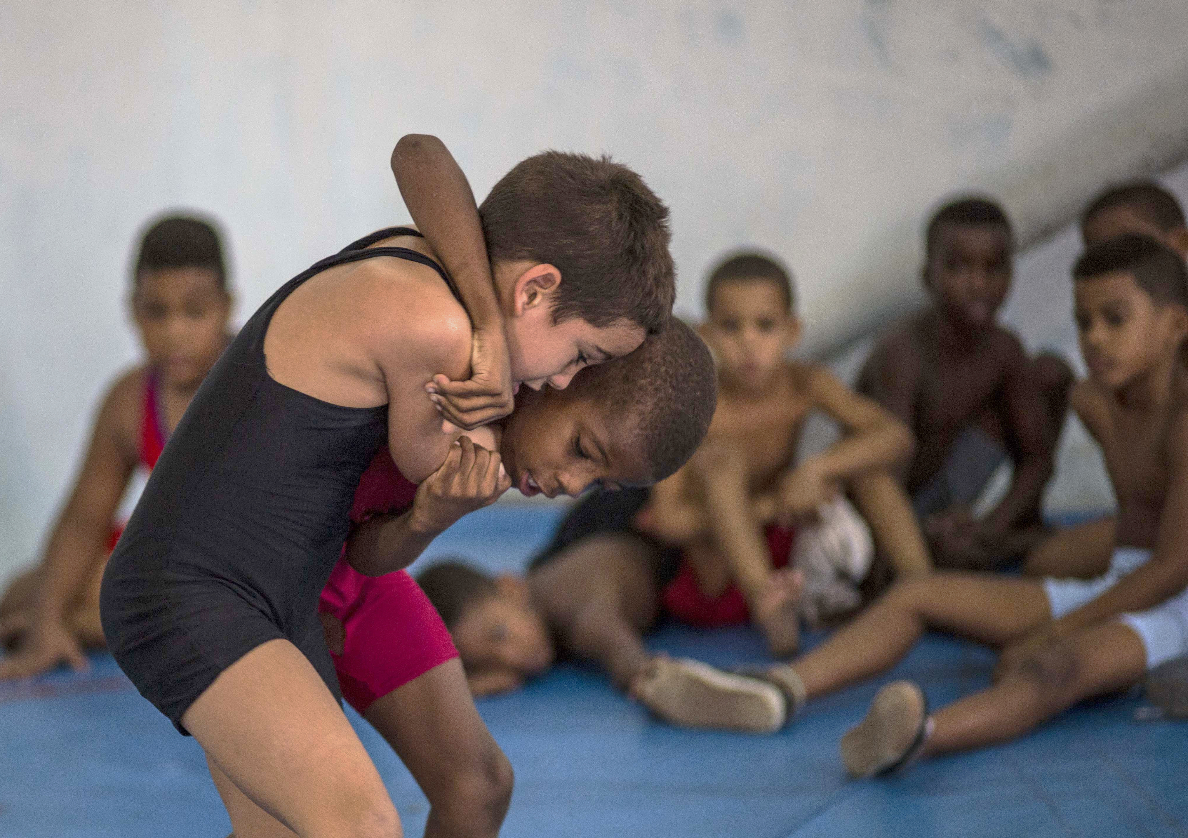 AP Photos: Children learn wrestling in Old Havana