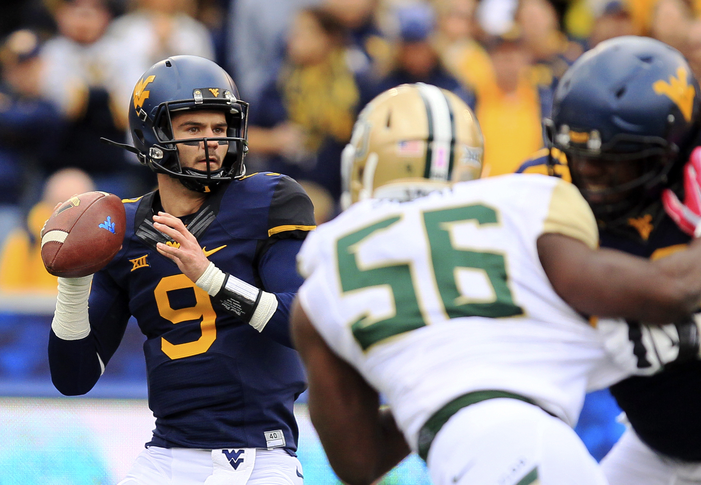 WVU QB Trickett gets scare from dad's health issue