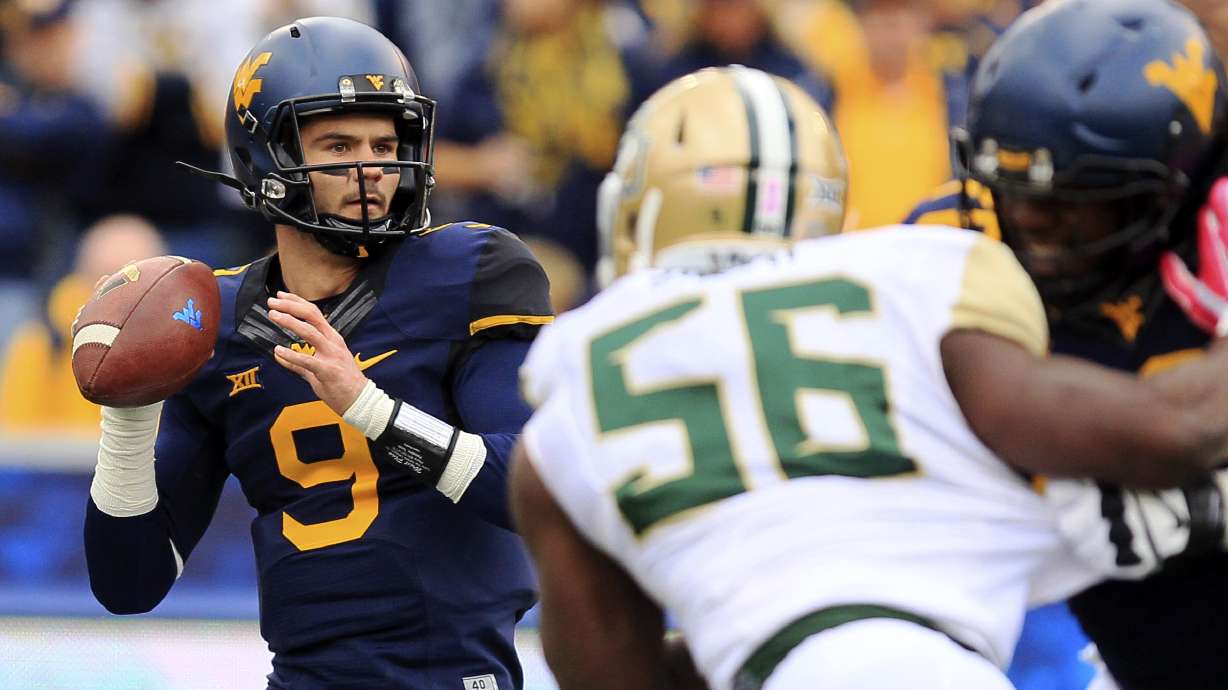 WVU QB Trickett gets scare from dad's health issue