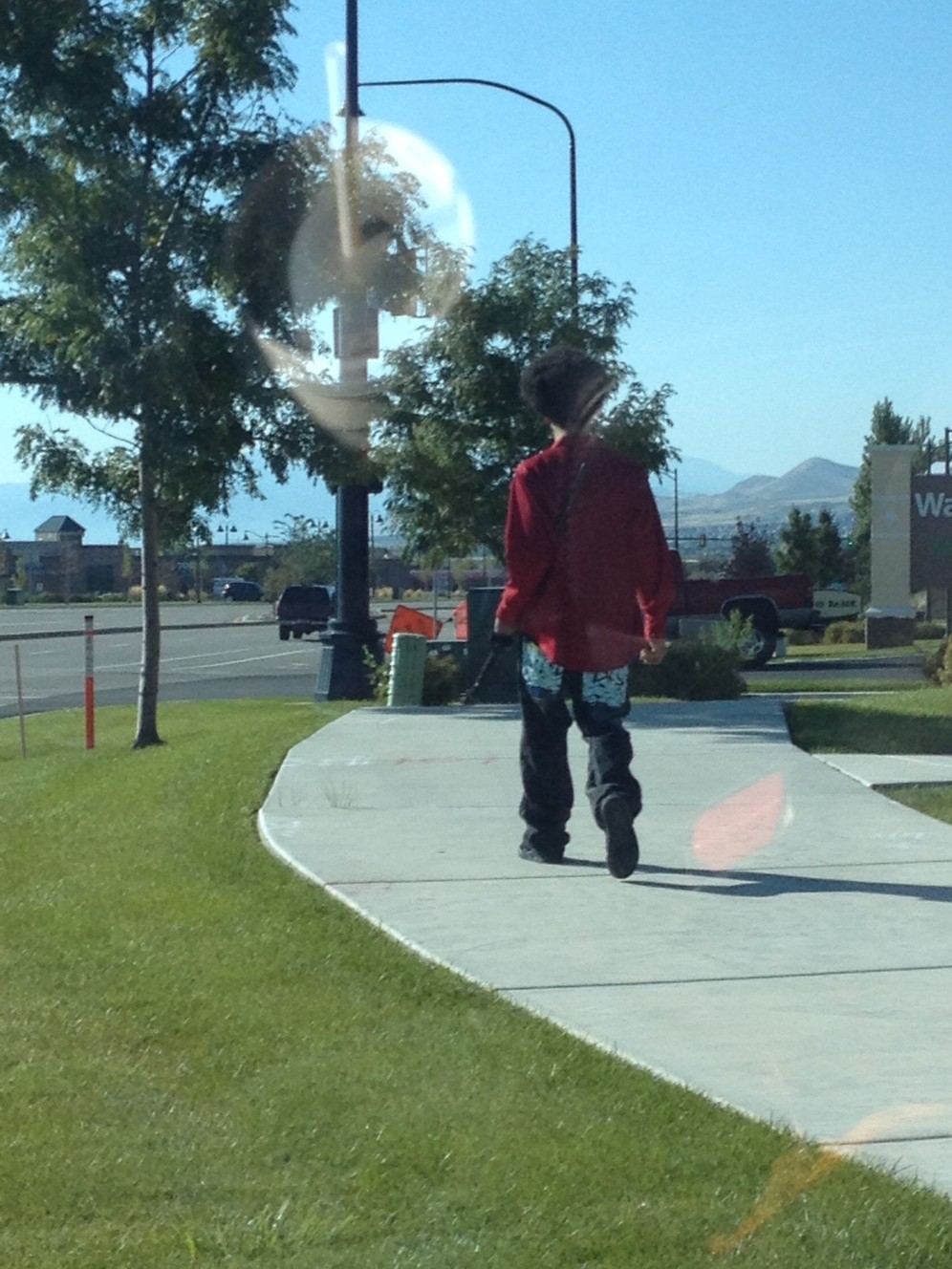 This photograph was taken minutes before Darrien Nathaniel Hunt, 22, of Saratoga Springs, was shot and killed by police Wednesday, Sept. 10, 2014, as he was walking near a Panda Express restaurant while carrying a Samurai sword. A woman driving in the area took the photo to send to her husband because she thought it was odd. But she said he didn't seem threatening. Investigators on Saturday said he brandished the sword and lunged toward officers, prompting them to shoot him. (Photo: Natalie Christensen)