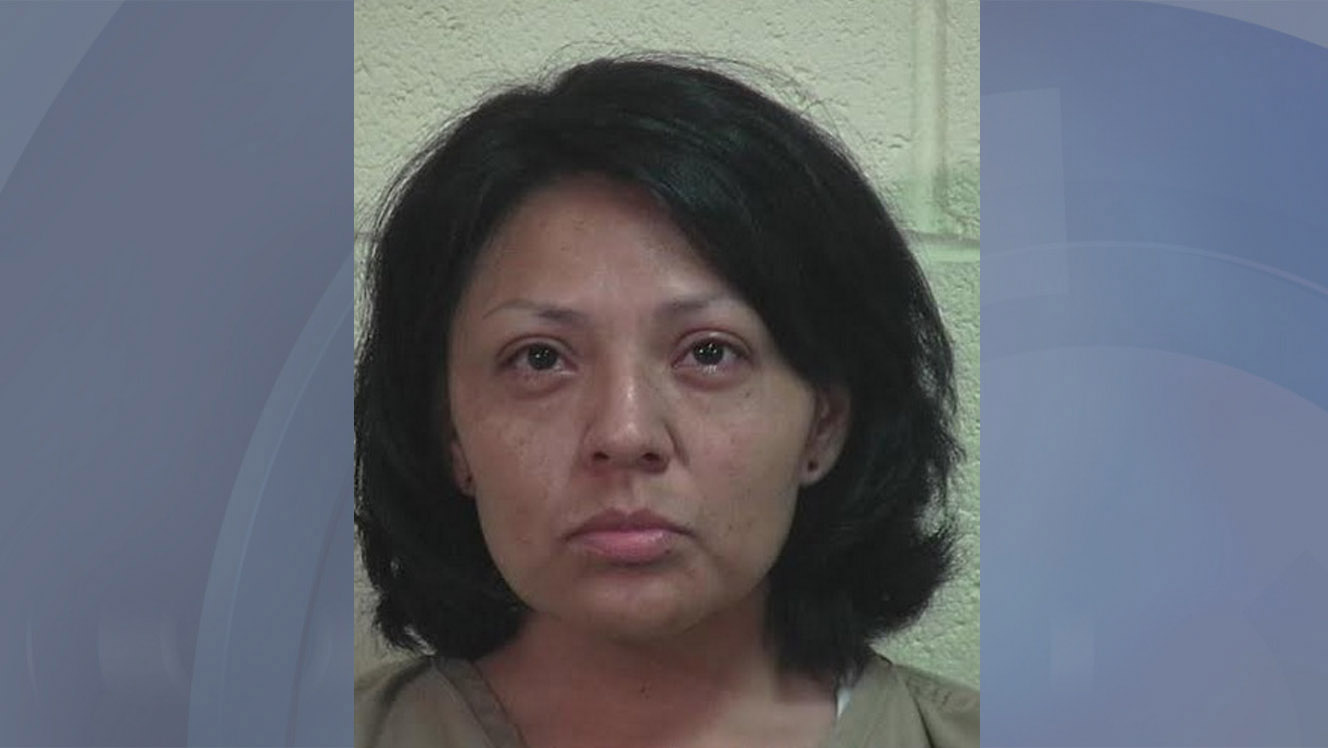 Woman uses handgun to strike man in school parking lot, police say